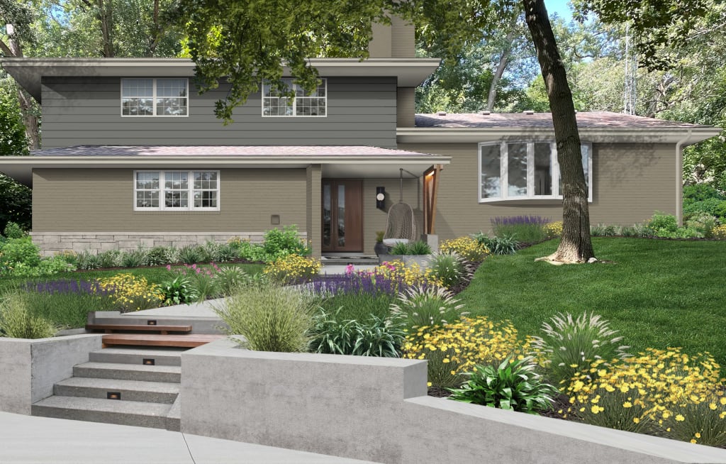 Split level home with lush wildflower landscaping and a stone retaining wall.
