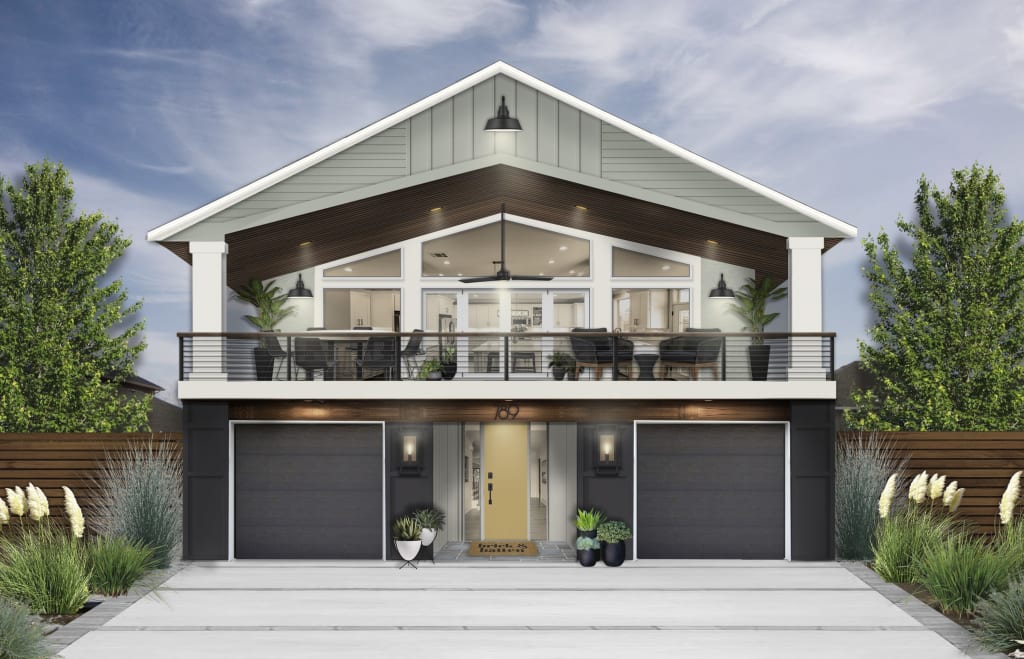 modern house with black siding on lower level and gray-green siding on upper half