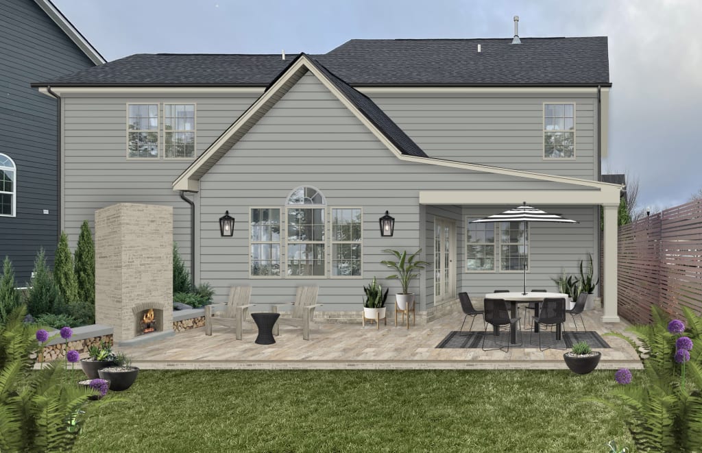 neutral exterior with an outdoor fireplace and dining table with an umbrella