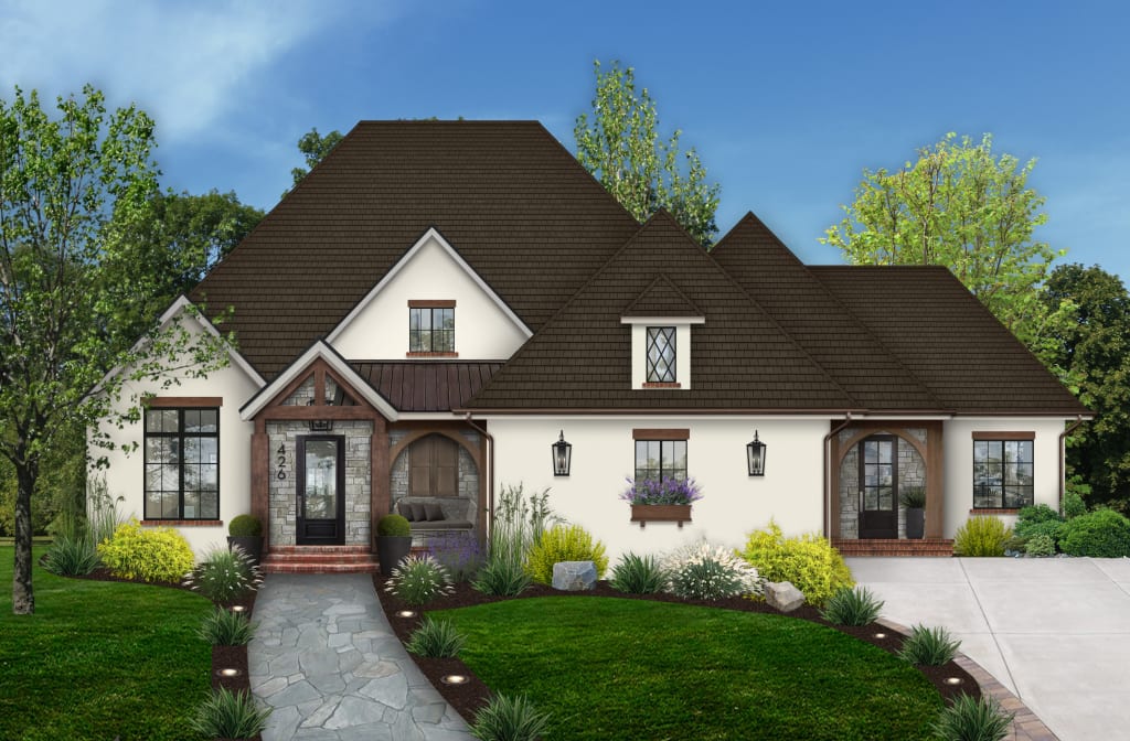 white tudor style home with wood arches and wall dormer window