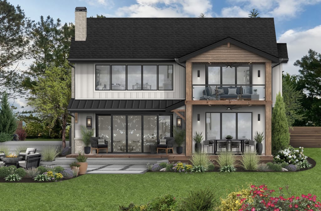 back of a home with an outdoor dining table with a fan above it