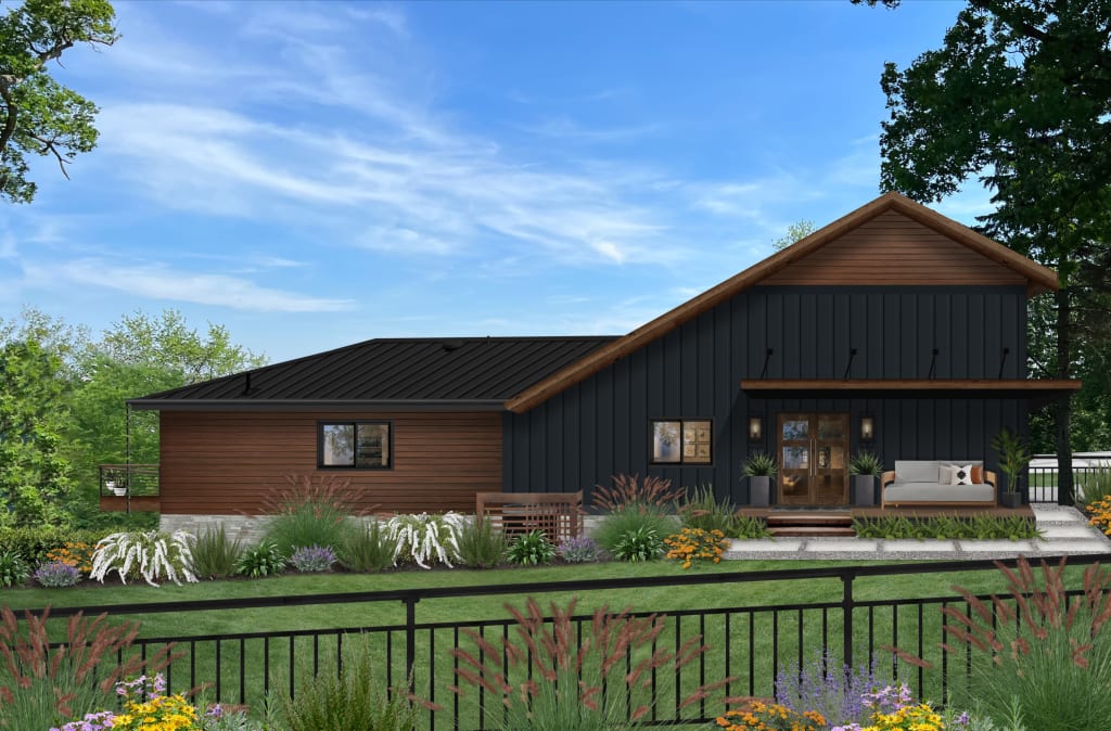 Exterior rear view of a mid-century modern home with a small deck