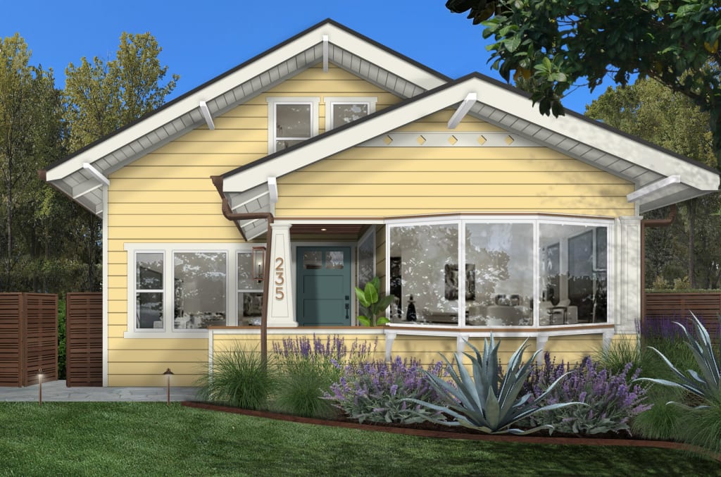 yellow house with green door showing the best bold exterior paint colors for 2025