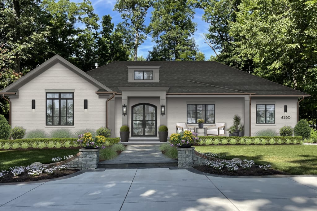 gray traditional one story home with a flat roof dormer