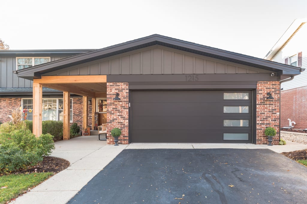 A close-up view of a home's garage and entryway