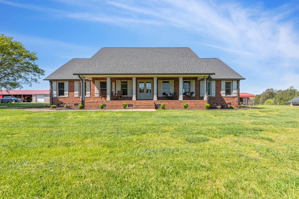 An actual after photo of a home with farmhouse porch columns