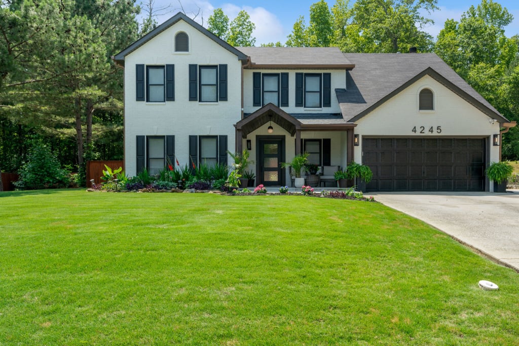 An actual after photo of a painted brick home