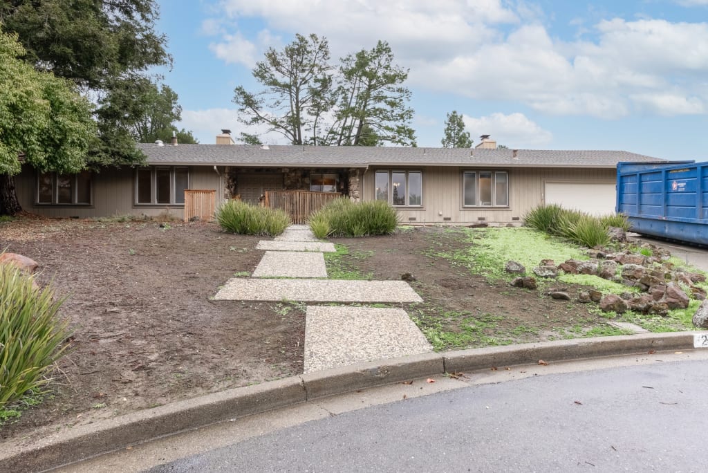 A before photo of a home about to undergo an exterior remodeling project.