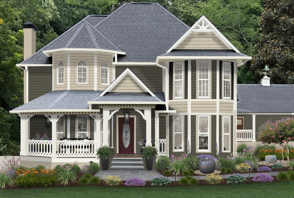 A two-story Victorian home with a curved porch, maroon red front door, and olive green shutters.