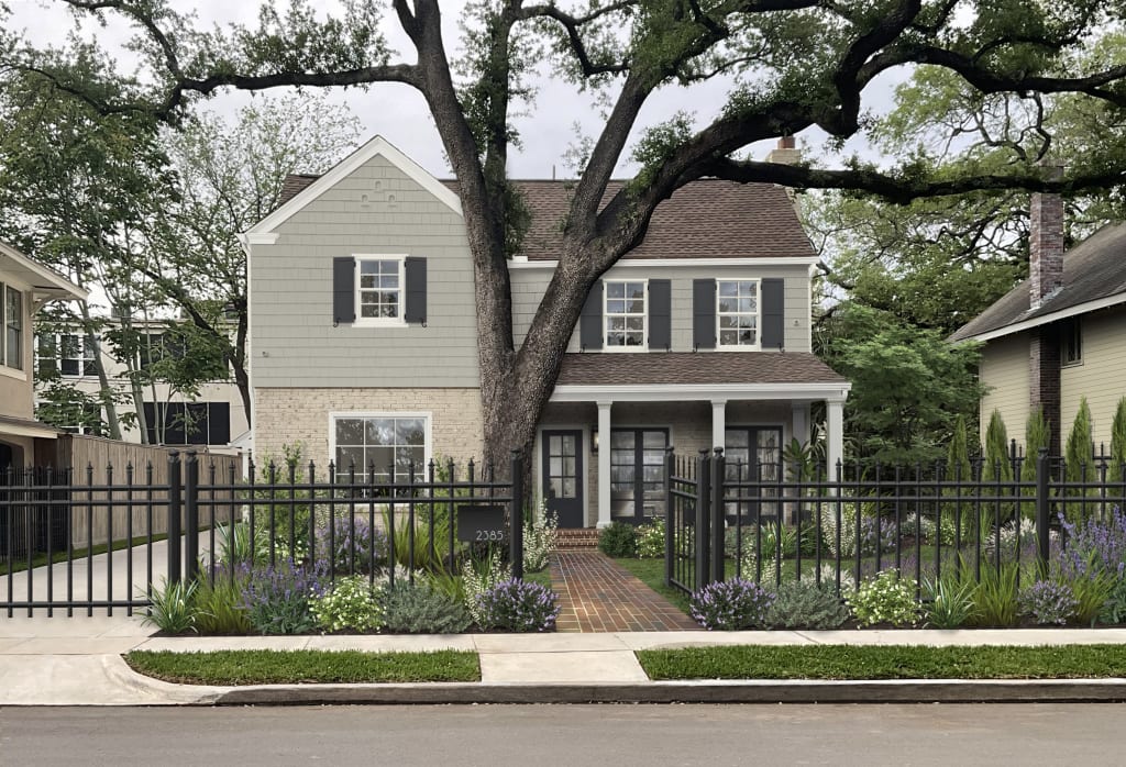 Traditional home with a brown roof and color palette of warm neutrals