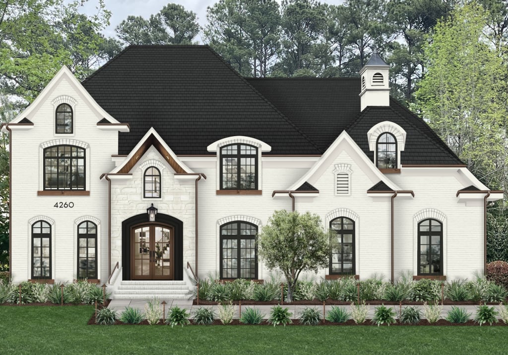 White traditional home with wood double doors, black widows, and copper gutters.