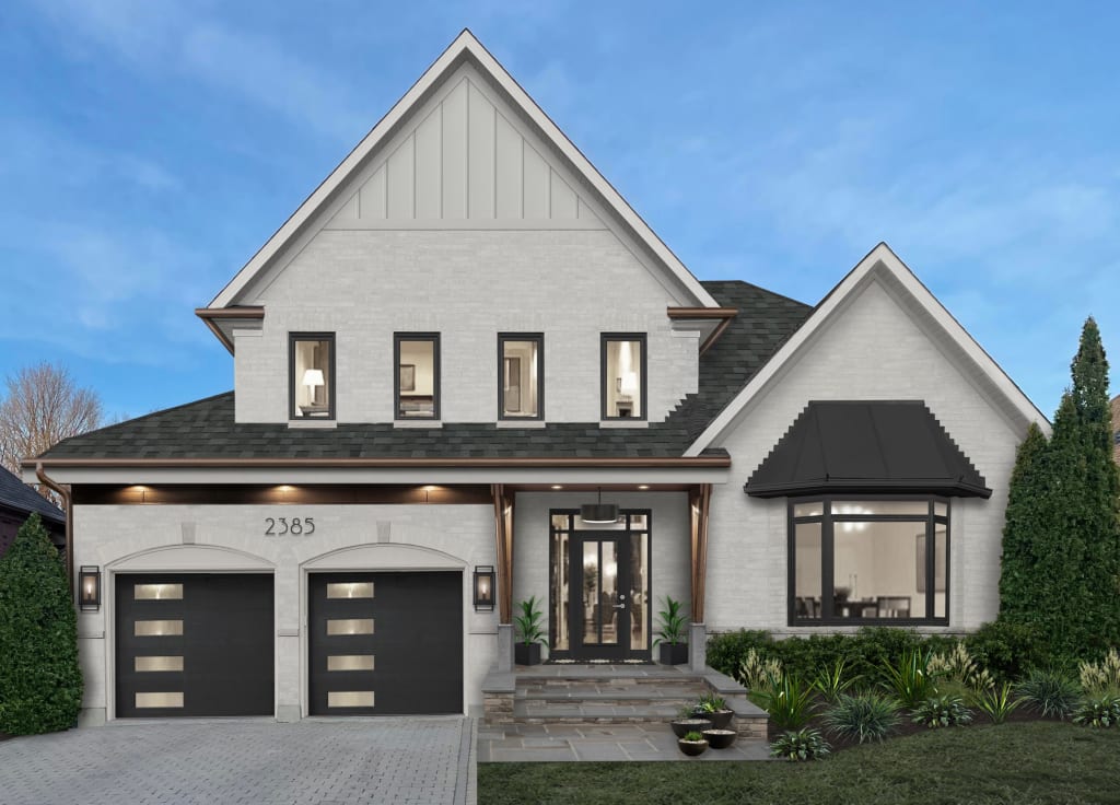 modern home with gray driveway pavers and stone walkway