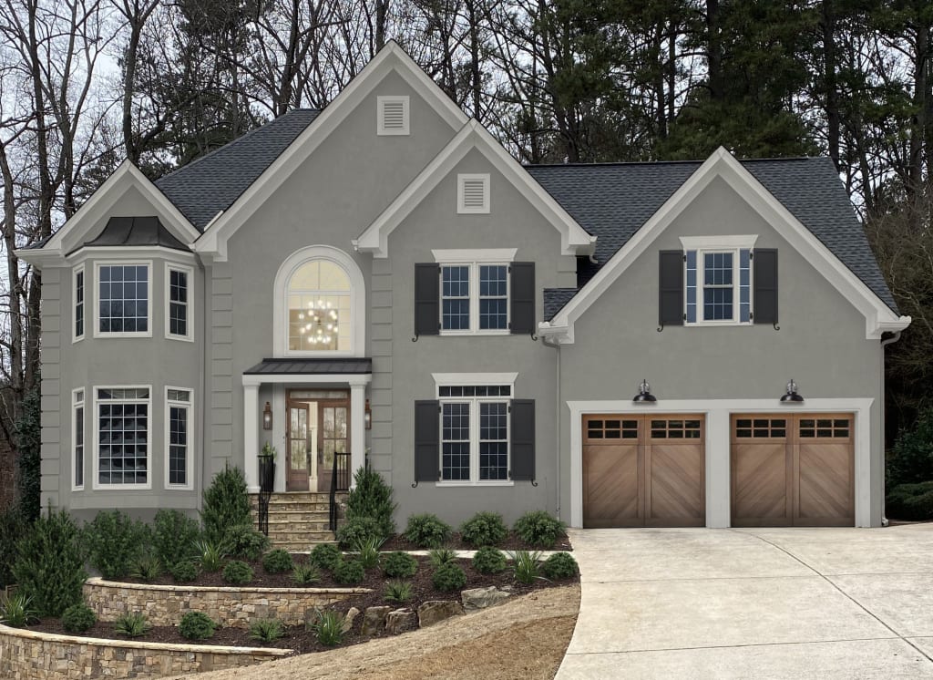 A stucco home with quoins