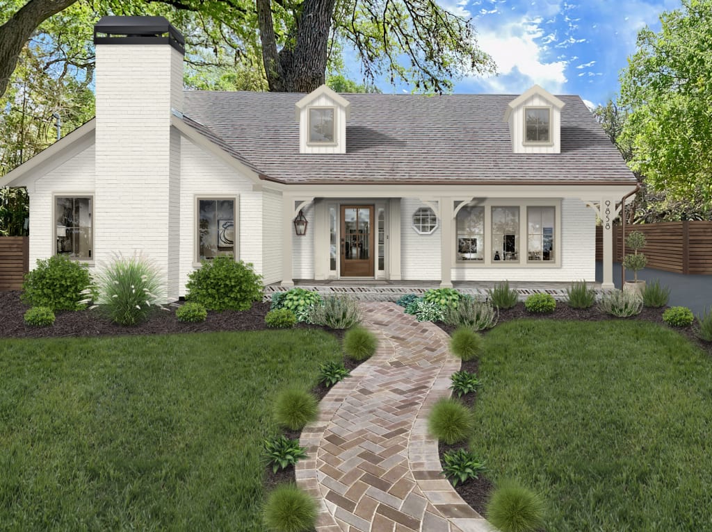 traditional home with dormers and herringbone pattern brick walkway