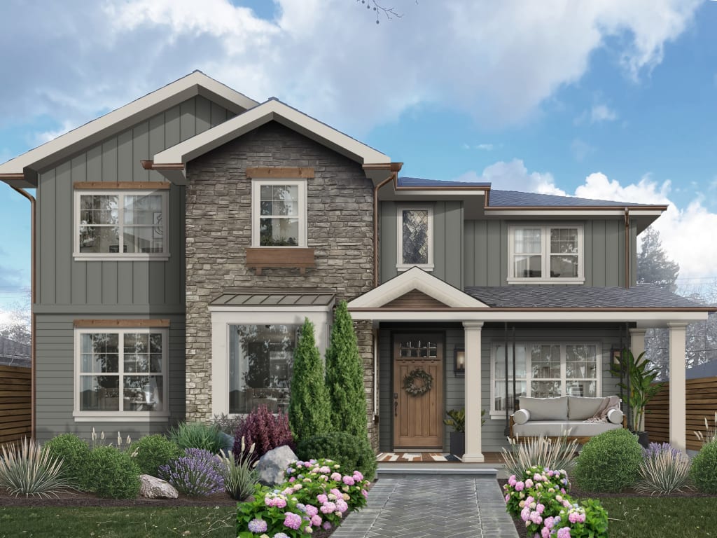 Traditional style, sage green home with stone accents, a wood door, and a porch swing.