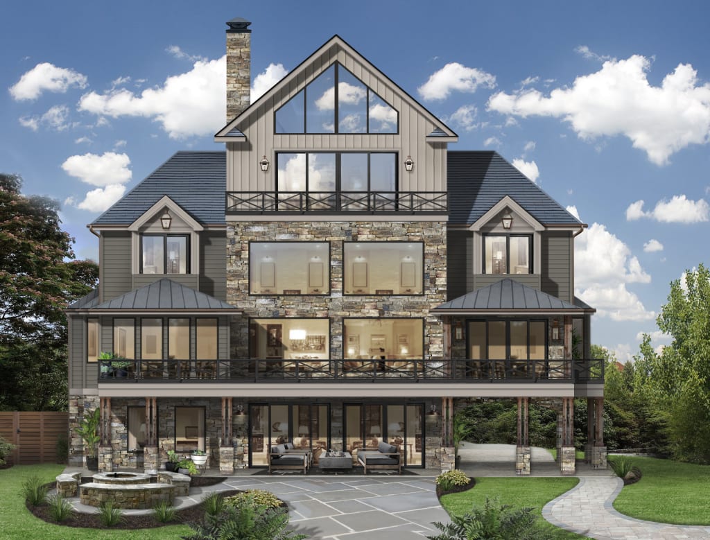 brick fire pit with built in benches in back patio of large 3 story stone home