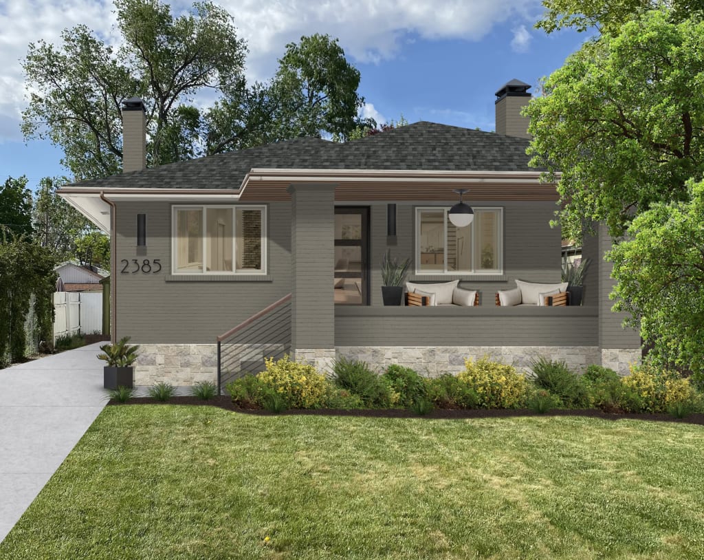 green neutral color bungalow with beige stone accents and black fixtures