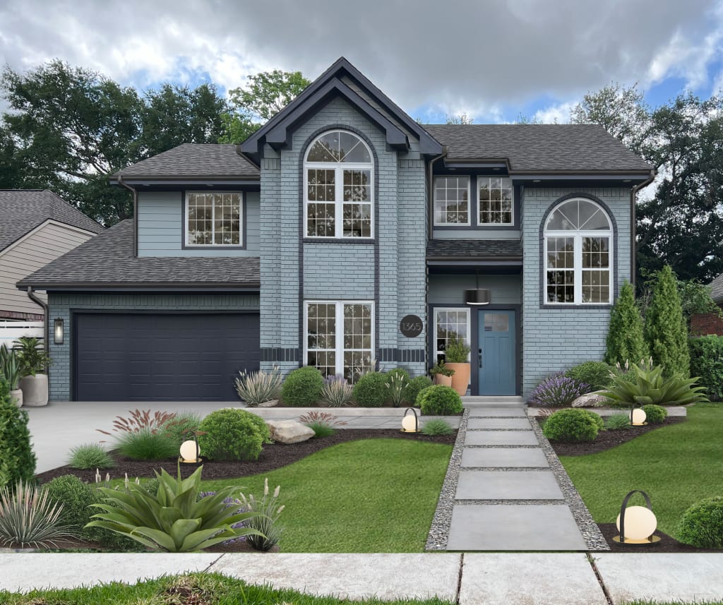 Two-story brick home painted in light blue with navy blue accents.