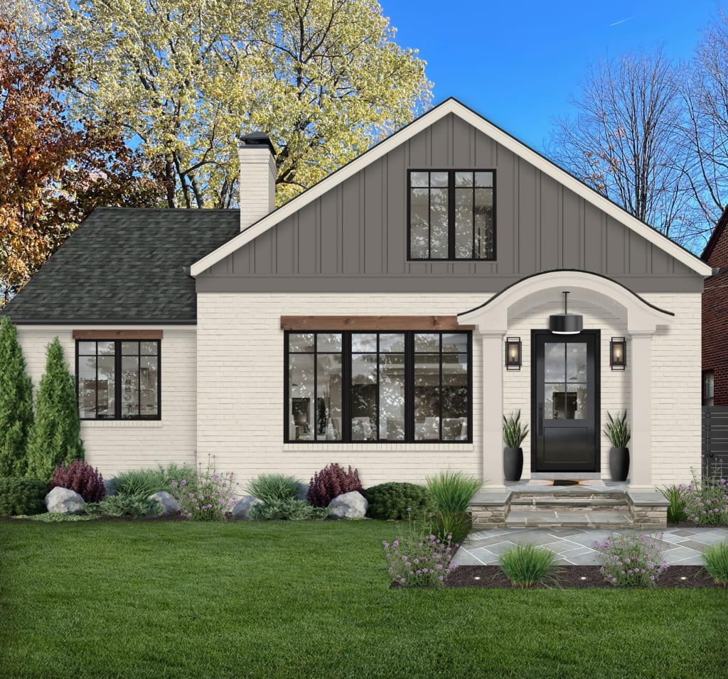 Small two story home with an arched portico, black front door, black windows, and wood lintels.
