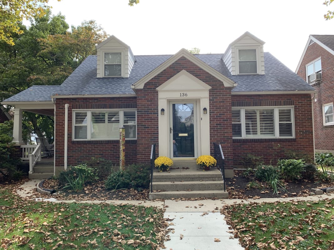 Exterior home design case study before, front facade, a brick Cape Cod home