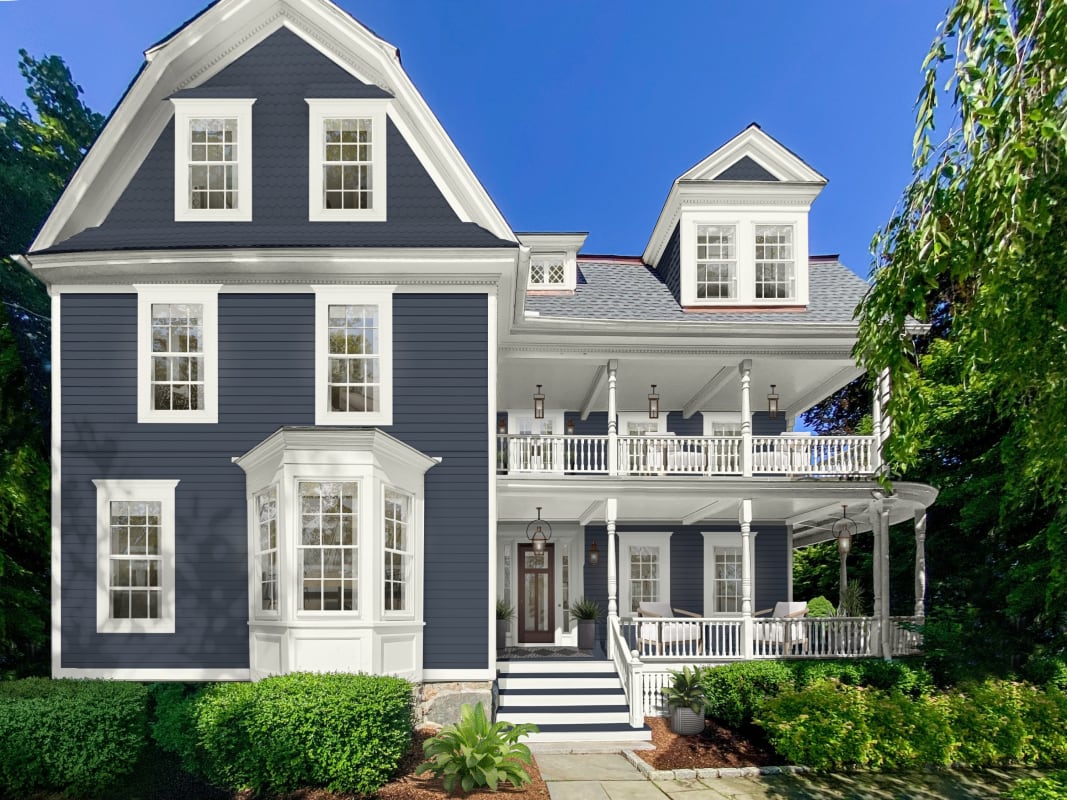 A three-story historic home rendered in Benjamin Moore's Hale Navy with white accents
