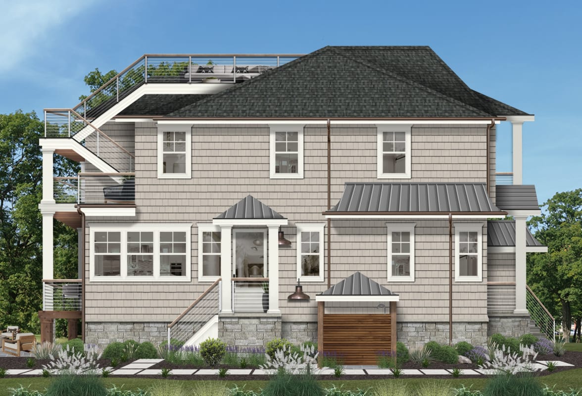 Side view of a home with a rooftop deck that has exterior access via stairs