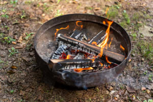 Poor fire pit design that is too small for the yard it's in.