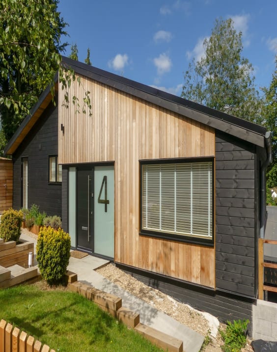 black home exterior with wood accents