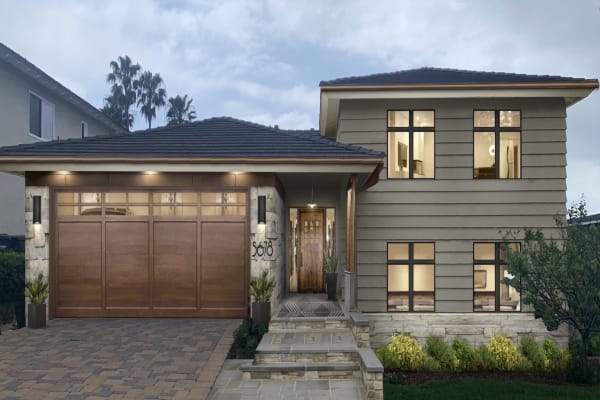 Virtual exterior design of a split level home with siding painted in Chelsea Gray and stone accents