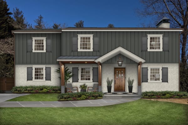 modern traditional colonial home with shutters and columns