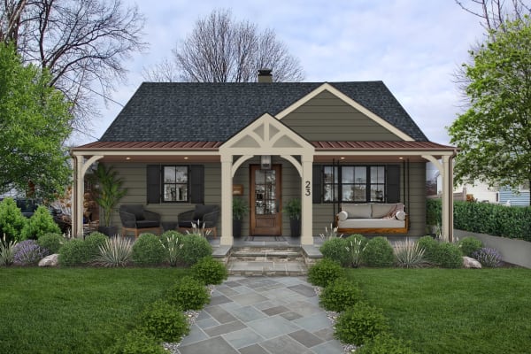 A small home with a dark green, earthy exterior design
