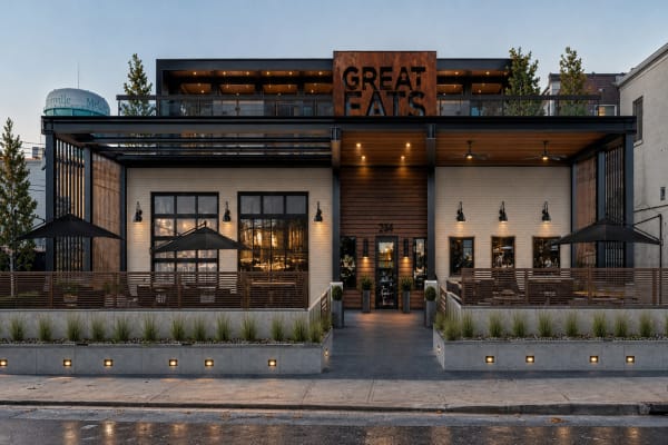 A restaurant exterior design by brick&batten for Great Eats, using natural materials and a warm color palette.