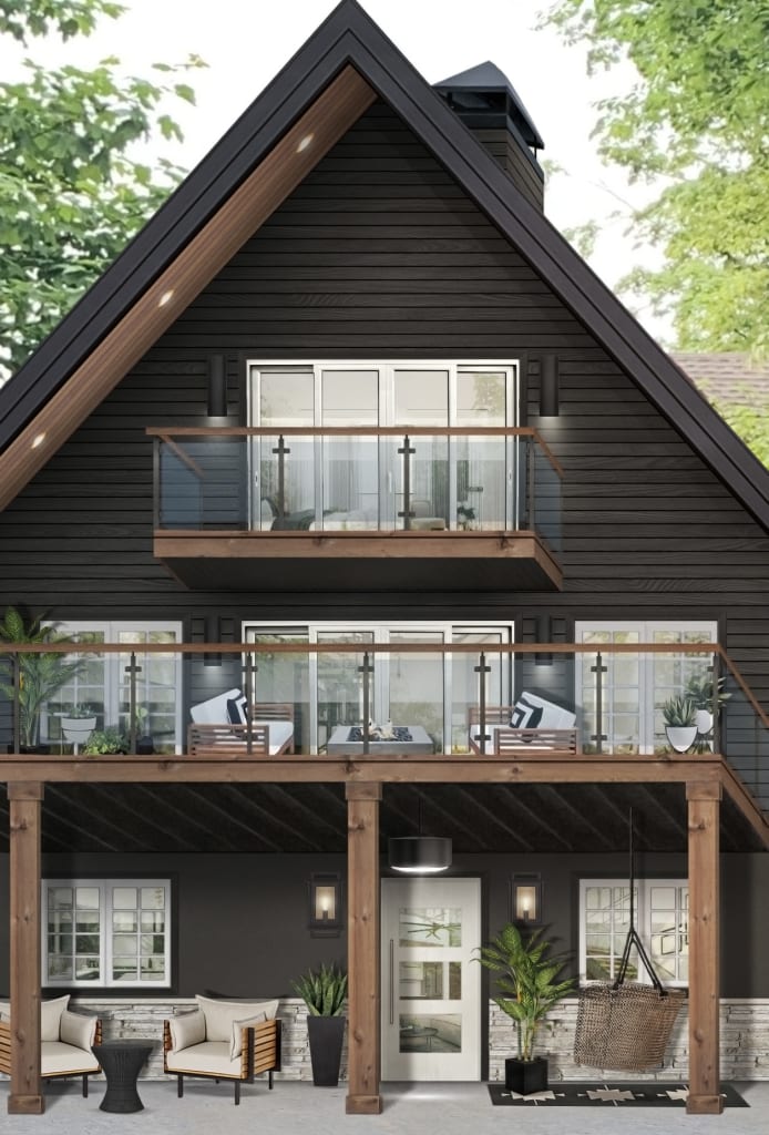 home with dark siding and glass paneled balcony railing with wood and iron accents