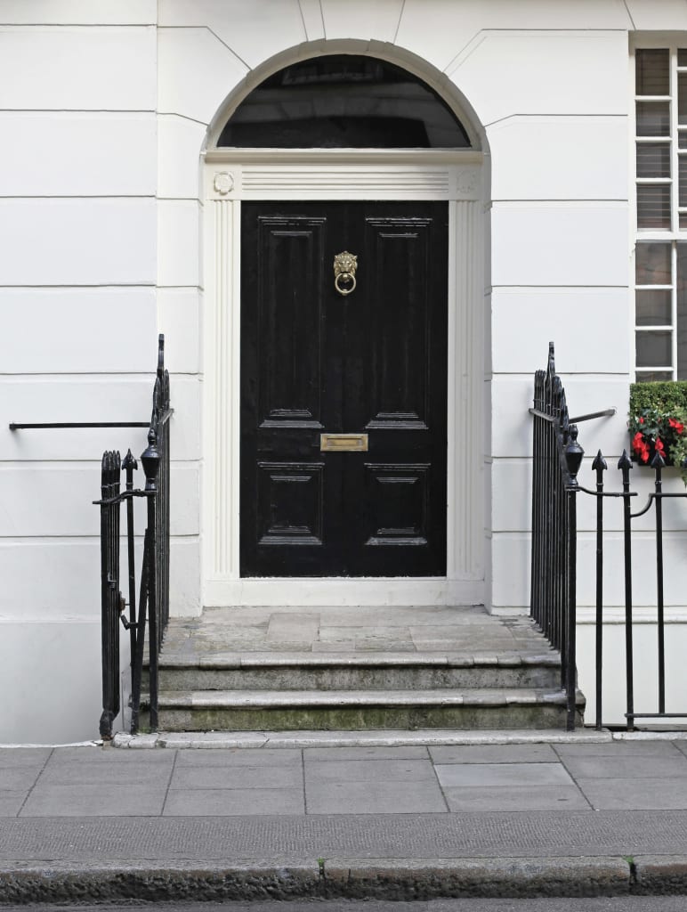 black door, brass hardware