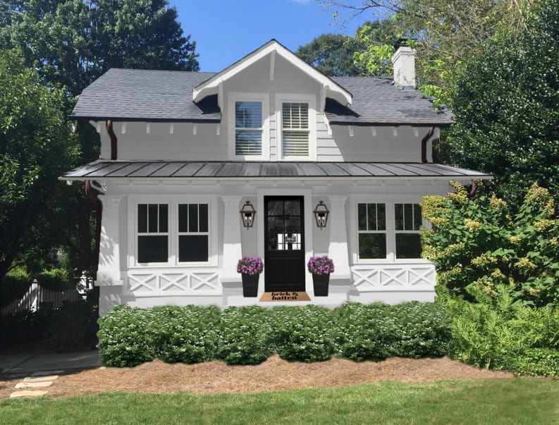 White cottage home with a black front door