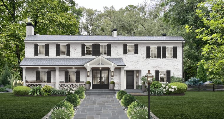 Two story brick home with limewash and front yard landscape lighting Two story brick home with limewash and front yard landscape lighting