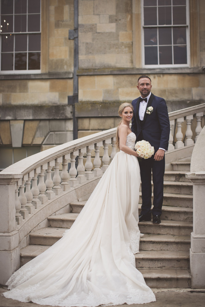 Faye and Adam Hughes in the church getting married