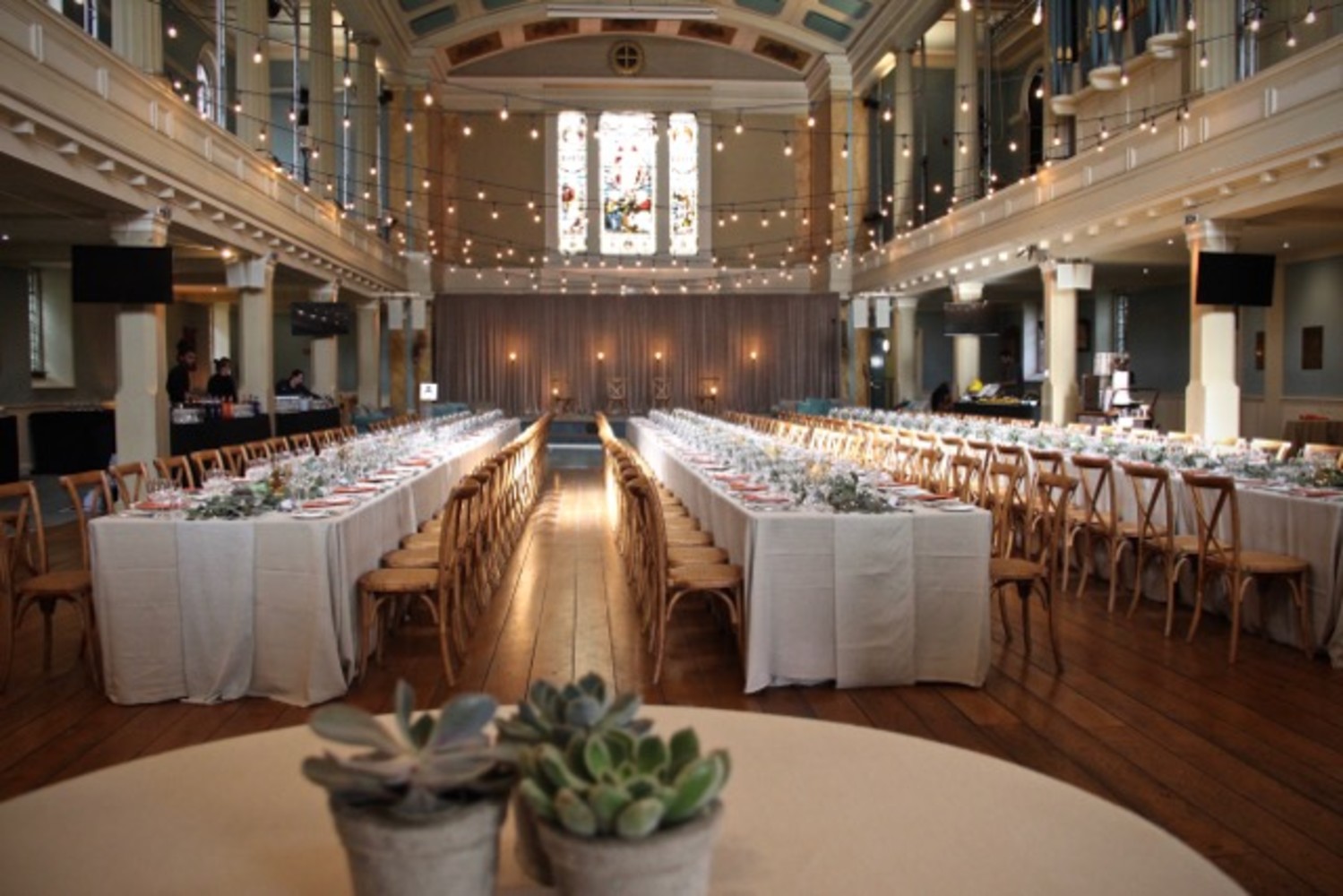 An archway that is part of the building serves as a place for the ceremony.