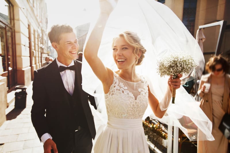 Bridebook.co.uk Sunny wedding bride and groom just married