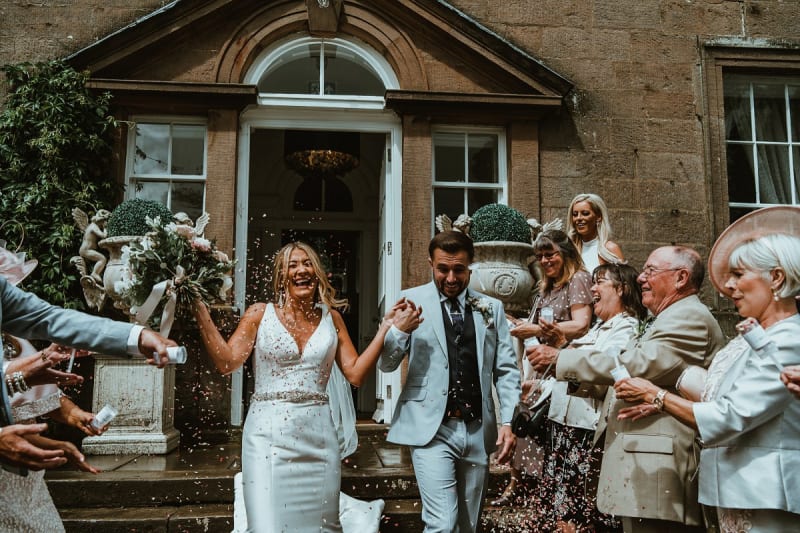 Faye and Adam Hughes in the church getting married