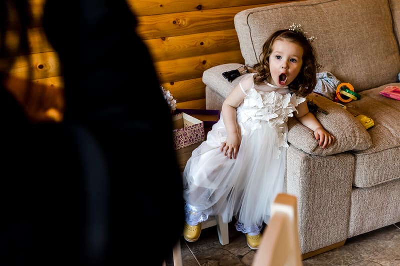 little girl looks surprised as she sees the bride. best wedding photos of 2018