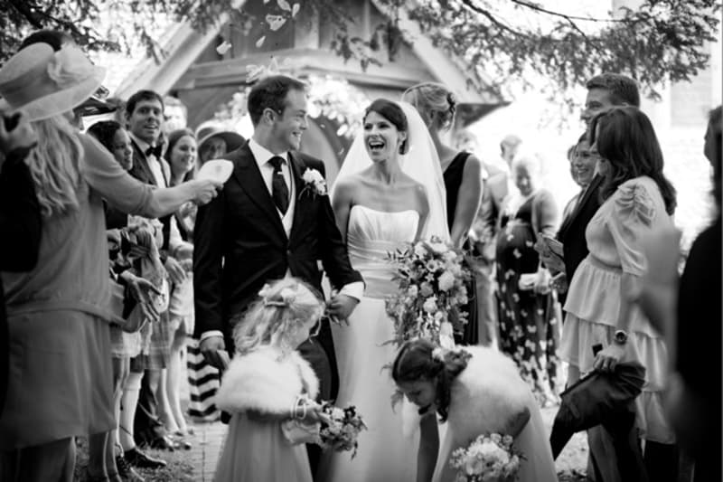 Bridebook.co.uk- bride and groom leaving ceremony