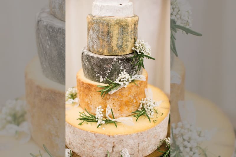 bridebook.co.uk cheese tower with white flowers