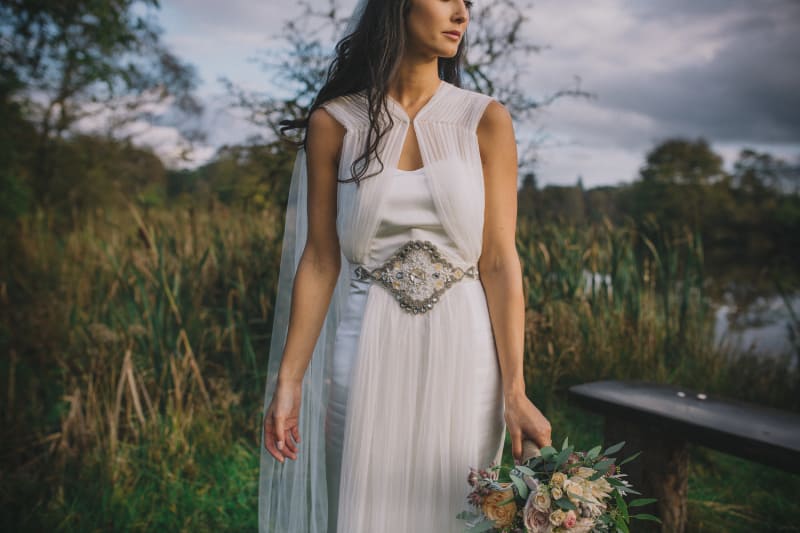 Bridebook.co.uk- bride in her wedding dress with belt embellishment
