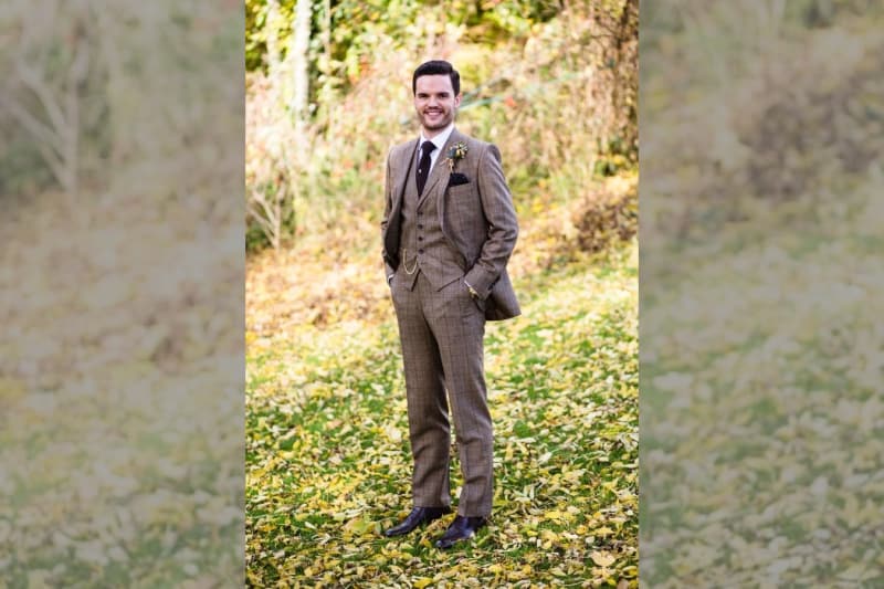 Bridebook.co.uk- groom in tweed suit