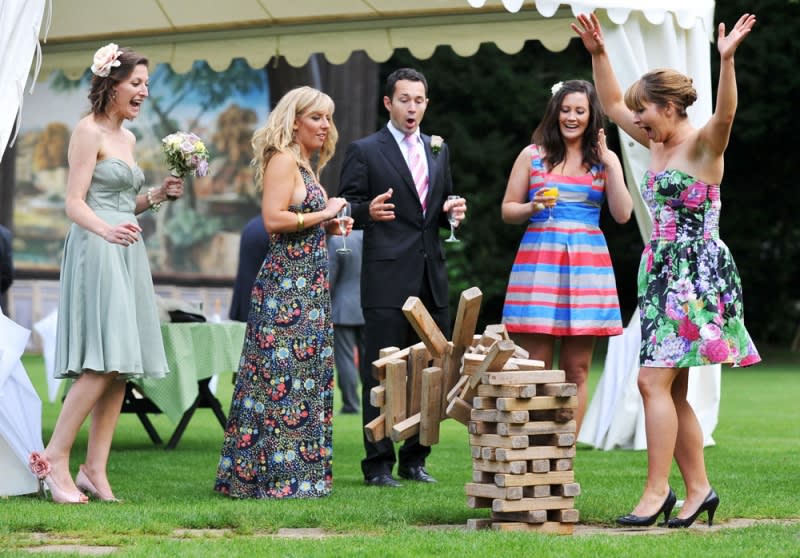 Bridebook.co.uk- guests playing giant jenga outside