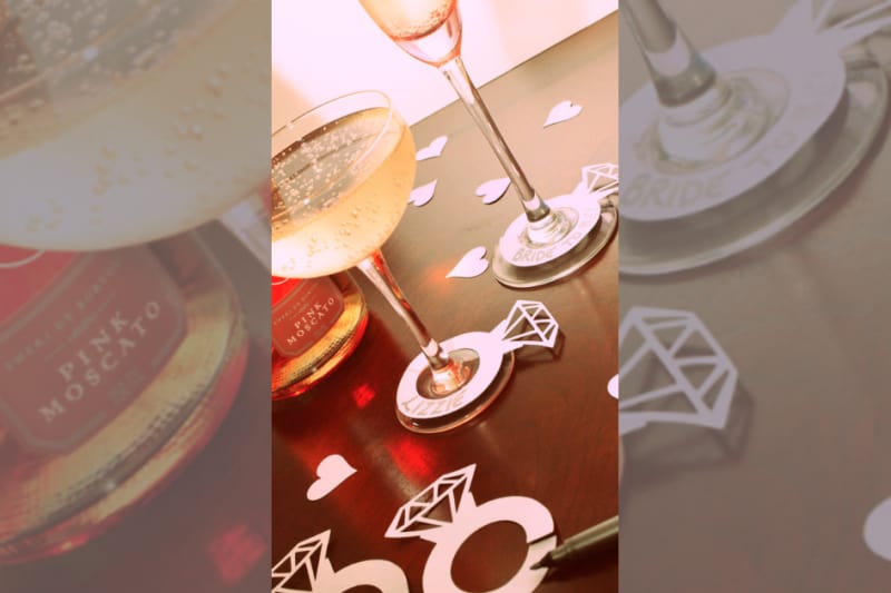 Bridebook.co.uk- champagne glasses with paper engagement rings