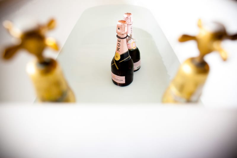 Bridebook.co.uk- bottles of moet champagne in a bathtub
