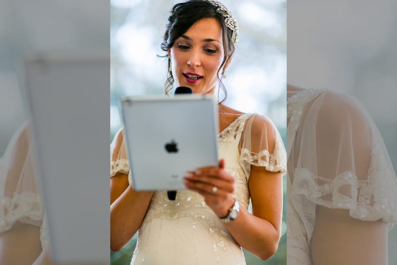 Bridebook.co.uk- bride reading her speech from ipad