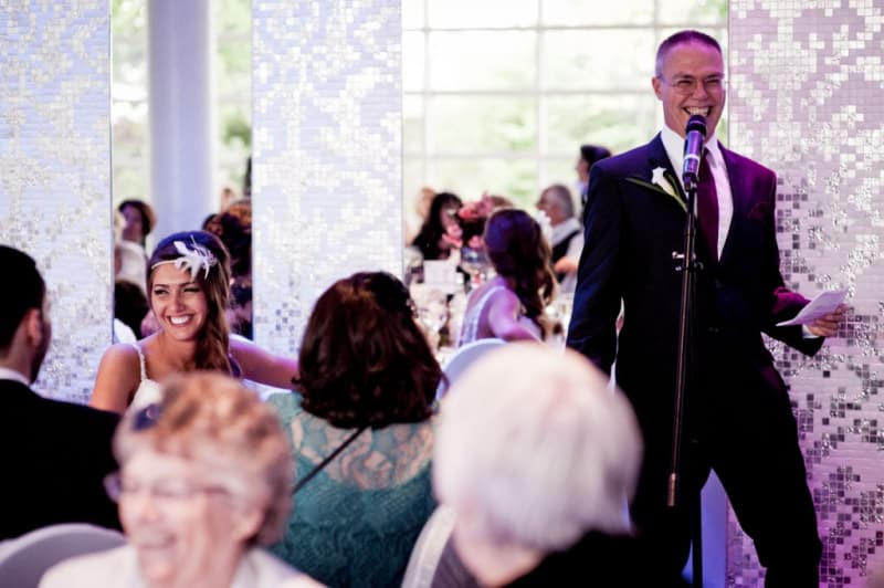 Bridebook.co.uk- father giving speech as bride smiles